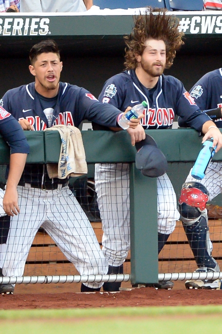 Jun 20, 2016; Omaha, NE, USA; The Arizona Wildcats bench warms up before the game against the Oklahoma State Cowboys in the 2016 College World Series at TD Ameritrade Park. Mandatory Credit: Steven Branscombe-USA TODAY Sports