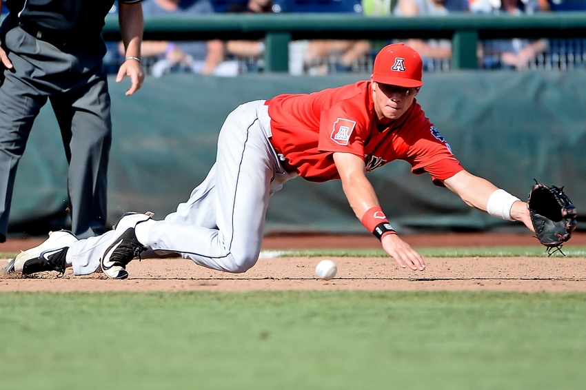 Jun 24, 2016; Omaha, NE, USA; Arizona Wildcats infielder Bobby Dalbec (3) makes a diving grab of a ground ball in the eighth inning against the Oklahoma State Cowboys in the 2016 College World Series at TD Ameritrade Park. Arizona defeated Oklahoma State 9-3. Mandatory Credit: Steven Branscombe-USA TODAY Sports