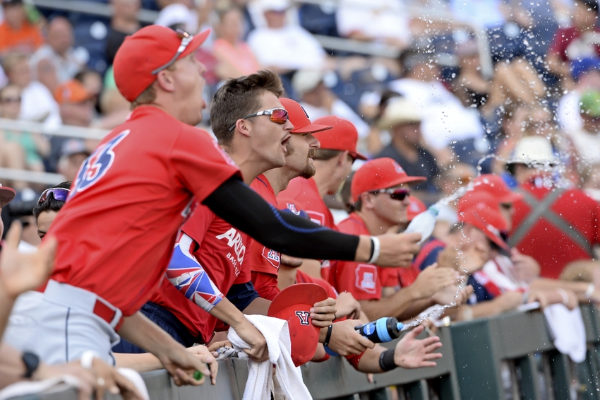 Jun 24, 2016; Omaha, NE, USA; The Arizona Wildcats bench cheer action against the Oklahoma State Cowboys in the 2016 College World Series at TD Ameritrade Park. Arizona defeated Oklahoma State 9-3. Mandatory Credit: Steven Branscombe-USA TODAY Sports