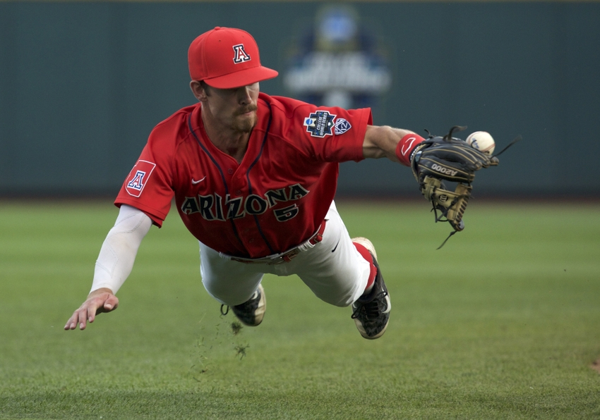 Jun 22, 2016; Omaha, NE, USA; Arizona Wildcats shortstop Louis Boyd (5) cannot field a grounder in the fifth inning against the UC Santa Barbara Gauchos in the 2016 College World Series at TD Ameritrade Park. Arizona won 3-0. Mandatory Credit: Bruce Thorson-USA TODAY Sports