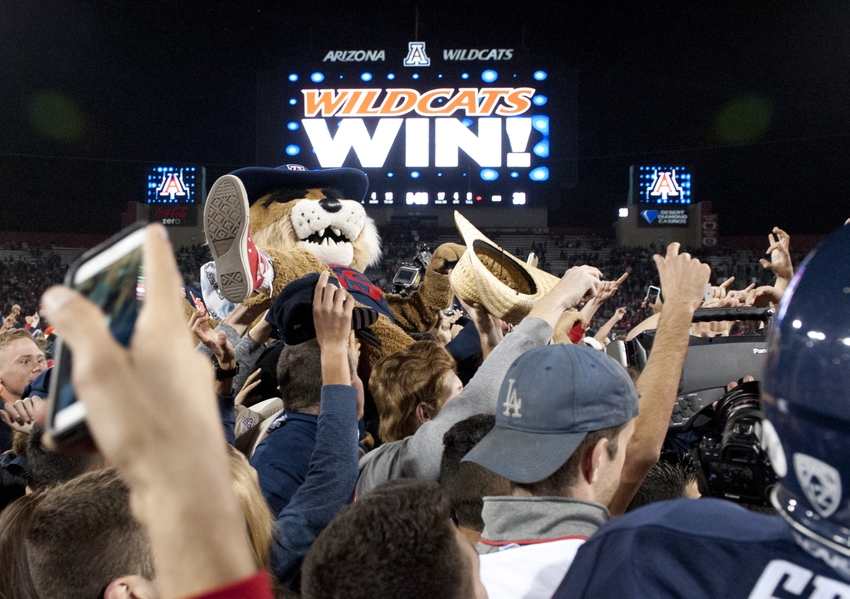 Nov 14, 2015; Tucson, AZ, USA; Arizona Wildcats mascot Wilbur surfs the crowd as students rush the field after defeating the Utah Utes at Arizona Stadium. Arizona won 37-30 in double overtime. Mandatory Credit: Casey Sapio-USA TODAY Sports