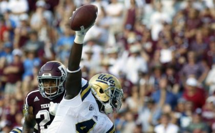 Sep 3, 2016; College Station, TX, USA; UCLA Bruins running back Bolu Olorunfunmi (4) celebrates his nine-yard touchdown run against the Texas A&M Aggies during the second half at Kyle Field. Texas A&M won in overtime 31-24. Mandatory Credit: Ray Carlin-USA TODAY Sports