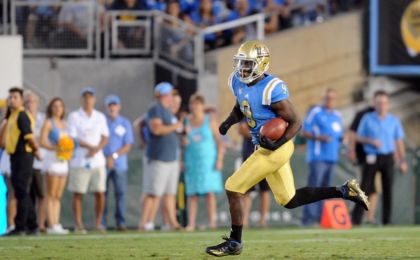 September 10, 2016; Pasadena, CA, USA; UCLA Bruins running back Soso Jamabo (9) runs the ball against the UNLV Rebels during the second half at Rose Bowl. Mandatory Credit: Gary A. Vasquez-USA TODAY Sports
