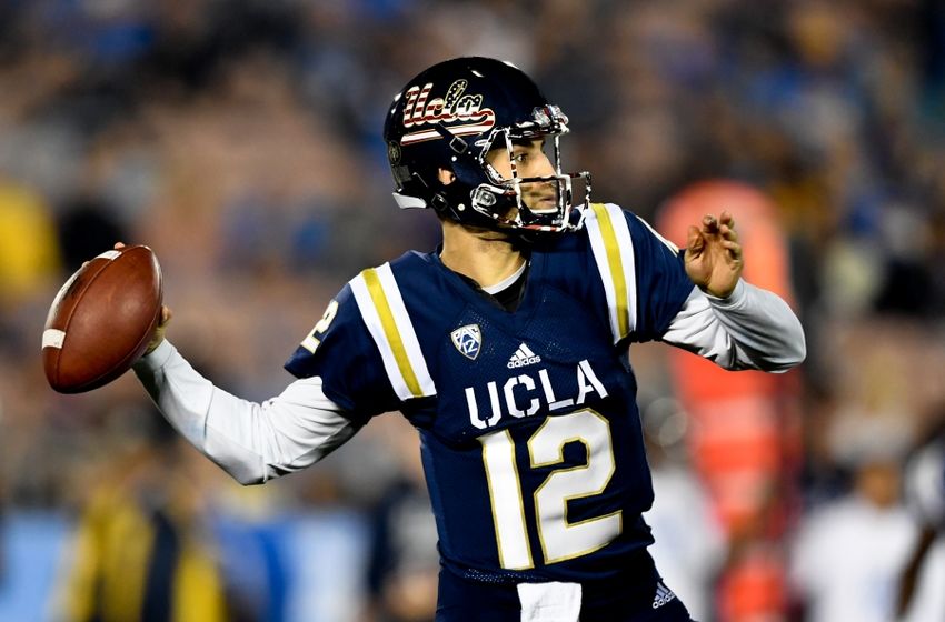 Nov 12, 2016; Pasadena, CA, USA; UCLA Bruins quarterback Mike Fafaul (12) passes against the Oregon State Beavers during the first half of a NCAA football game at Rose Bowl. Mandatory Credit: Kirby Lee-USA TODAY Sports