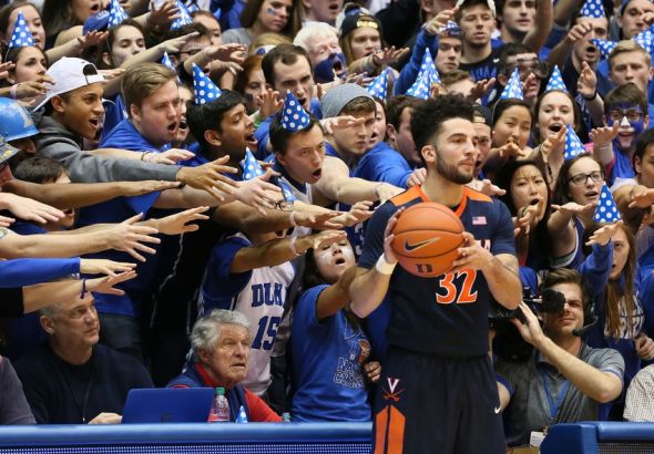 Feb 13, 2016; Durham, NC, USA; As Virginia Cavaliers guard London Perrantes (32) prepares to throw the ball in to a teammate he is taunted by Duke Blue Devils fans in the second half of their game at Cameron Indoor Stadium. Mandatory Credit: Mark Dolejs-USA TODAY Sports