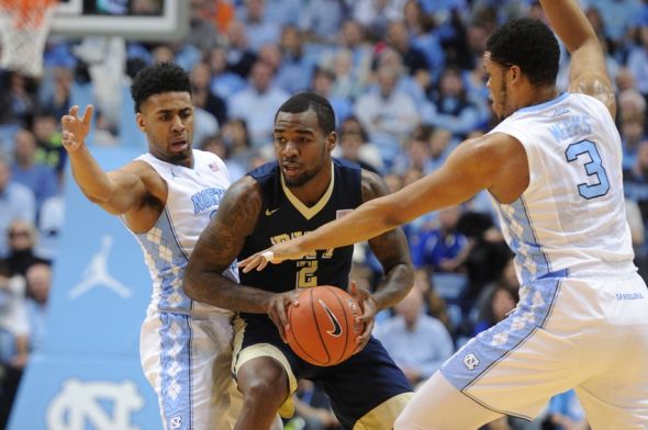 Feb 14, 2016; Chapel Hill, NC, USA; North Carolina Tar Heels guard Joel Berry II (2) and guard Joel Berry II (2) trap Pittsburgh Panthers forward Michael Young (2) during the first half at Dean E. Smith Center. Mandatory Credit: Evan Pike-USA TODAY Sports