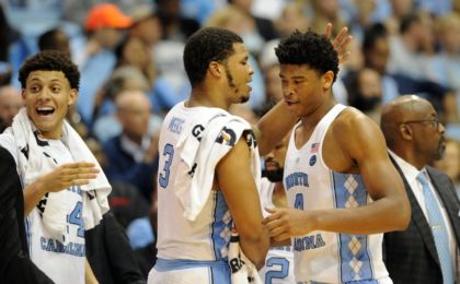 Nov 15, 2016; Chapel Hill, NC, USA; North Carolina Tar Heels forward Justin Jackson (44) and forward Kennedy Meeks (3) and forward Isaiah Hicks (4) celebrate in game against Long Beach State 49ers during the second half at Dean E. Smith Center. North Carolina won 93-67. Mandatory Credit: Evan Pike-USA TODAY Sports