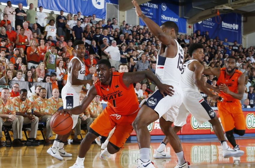 Nov 21, 2016; Lahaina, Maui, HI, USA; Oklahoma State Cowboys guard Jawun Evans (1) drives to the basket against UCONN Huskies guard Rodney Purvis (15) during the Maui Jim Maui Invitational at the Lahaina Civic Center. Mandatory Credit: Brian Spurlock-USA TODAY Sports