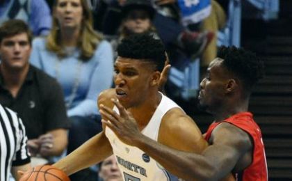 Dec 7, 2016; Chapel Hill, NC, USA; North Carolina Tar Heels forward Tony Bradley (5) controls the ball in front of Davidson Wildcats forward Nathan Ekwu (1) during the first half at Dean E. Smith Center. Mandatory Credit: Rob Kinnan-USA TODAY Sports