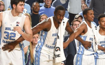 Jan 8, 2017; Chapel Hill, NC, USA; North Carolina Tar Heels forwards Luke Maye (32) and Theo Pinson (1) and guard Kenny Williams (24) on the bench in the second half. The Tar Heels defeated the Wolfpack 107-56 at Dean E. Smith Center. Mandatory Credit: Bob Donnan-USA TODAY Sports