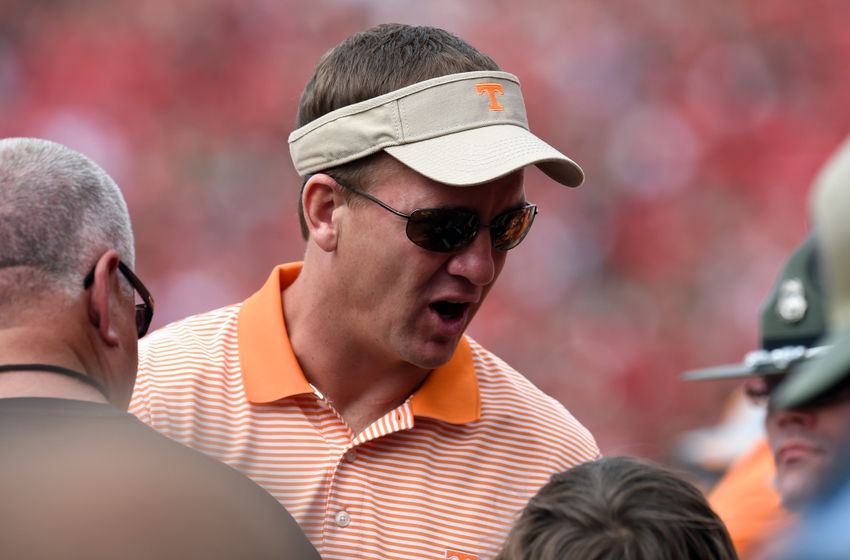 Sep 27, 2014; Athens, GA, USA; Denver Broncos quarterback Peyton Manning shown talking to fans on the sidelines during the game between the Tennessee Volunteers and the Georgia Bulldogs during the first half at Sanford Stadium. Mandatory Credit: Dale Zanine-USA TODAY Sports