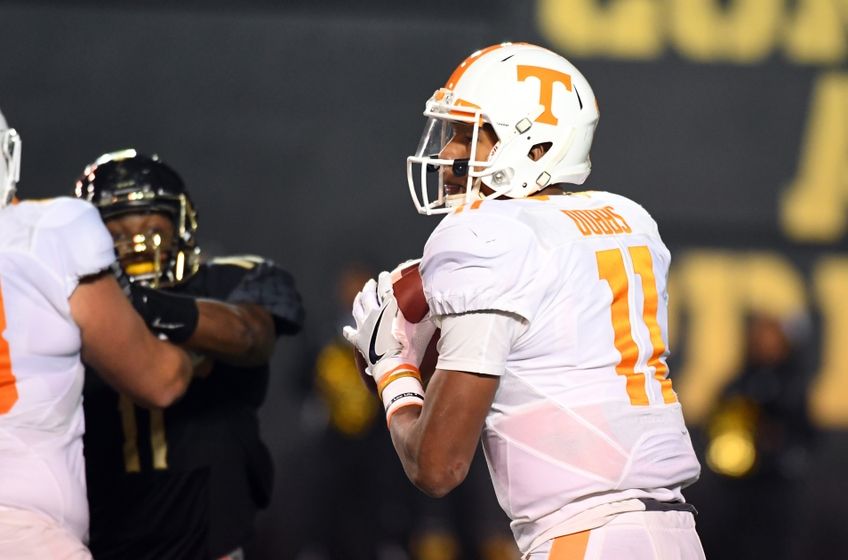 Nov 26, 2016; Nashville, TN, USA; Tennessee Volunteers quarterback Joshua Dobbs (11) drops back to pass during the first half against the Vanderbilt Commodores at Vanderbilt Stadium. Mandatory Credit: Christopher Hanewinckel-USA TODAY Sports