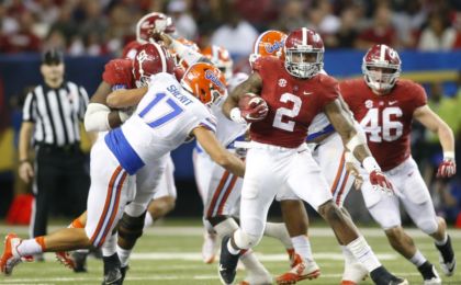 Dec 5, 2015; Atlanta, GA, USA; Alabama Crimson Tide running back Derrick Henry (2) carries the ball past Florida Gators defensive lineman Jordan Sherit (17) during the fourth quarter in the 2015 SEC Championship Game at the Georgia Dome. Mandatory Credit: Brett Davis-USA TODAY Sports
