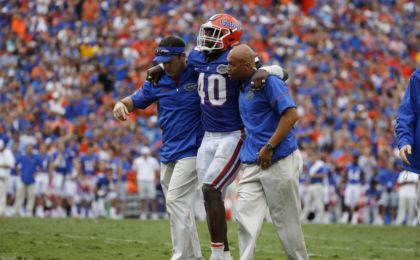 Oct 15, 2016; Gainesville, FL, USA; Florida Gators linebacker Jarrad Davis (40) is helped off the field after an apparent injury against the Missouri Tigers during the second half at Ben Hill Griffin Stadium. Florida Gators defeated the Missouri Tigers 40-14. Mandatory Credit: Kim Klement-USA TODAY Sports