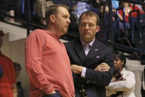 Dec 22, 2015; Oxford, MS, USA; Mississippi Rebels head football coach Hugh Freeze talks with Mississippi athletic director Ross Bjork during a mens basketball game between the Rebels and the Troy Trojans at the Tad Smith Coliseum. Mississippi defeated Troy 83-80. Mandatory Credit: Spruce Derden-USA TODAY Sports