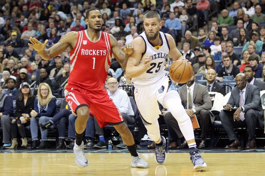 Dec 23, 2016; Memphis, TN, USA; Memphis Grizzlies forward Chandler Parsons (25) drives against Houston Rockets forward Trevor Ariza (1) during the first half at FedExForum. Mandatory Credit: Nelson Chenault-USA TODAY Sports