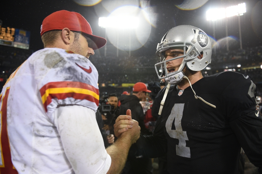 November 20, 2014; Oakland, CA, USA; Oakland Raiders quarterback Derek Carr (4) is congratulated by Kansas City Chiefs quarterback Alex Smith (11) after the game at O.co Coliseum. The Raiders defeated the Chiefs 24-20. Mandatory Credit: Kyle Terada-USA TODAY Sports