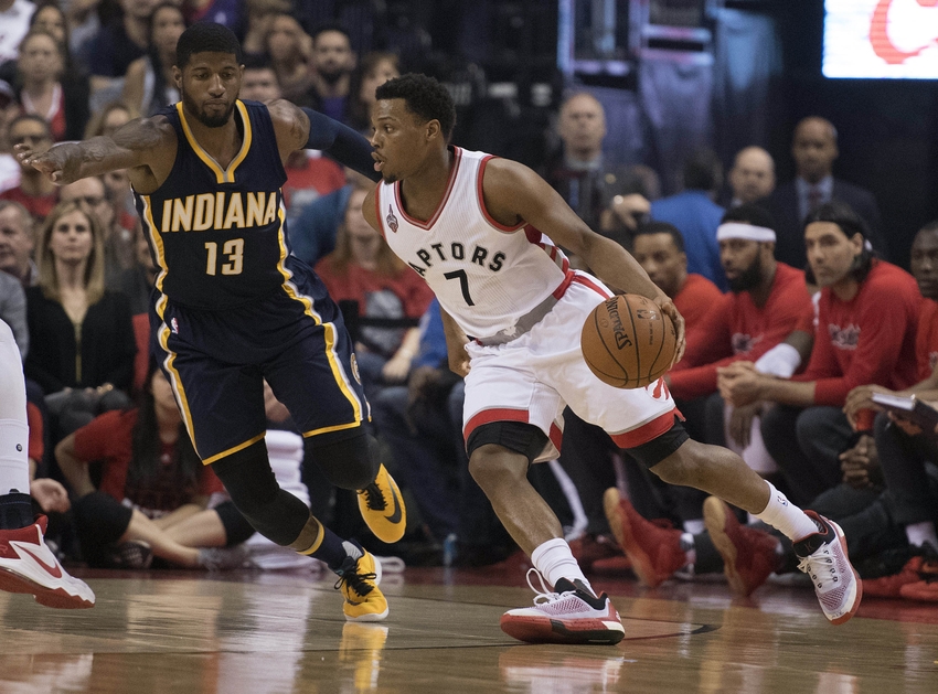 Apr 26, 2016; Toronto, Ontario, CAN; Toronto Raptors guard Kyle Lowry (7) looks to play a ball as Indiana Pacers forward Paul George (13) tries to defend during the first quarter in game five of the first round of the 2016 NBA Playoffs at Air Canada Centre. Mandatory Credit: Nick Turchiaro-USA TODAY Sports