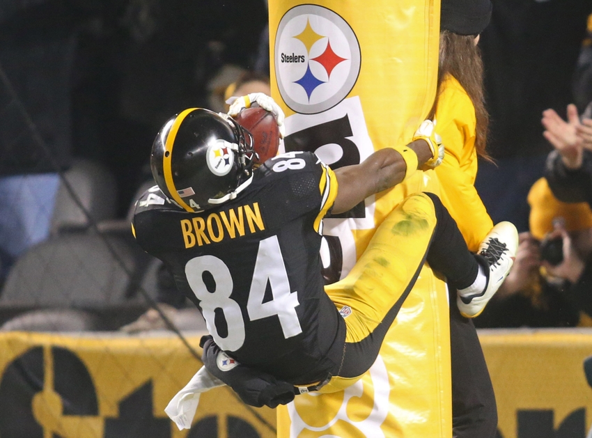 Dec 6, 2015; Pittsburgh, PA, USA; Pittsburgh Steelers wide receiver Antonio Brown (84) jumps onto the goal post padding after scoring on a seventy-one yard punt return for a touchdown against the Indianapolis Colts during the fourth quarter at Heinz Field. The Steelers won 45-10. Mandatory Credit: Charles LeClaire-USA TODAY Sports