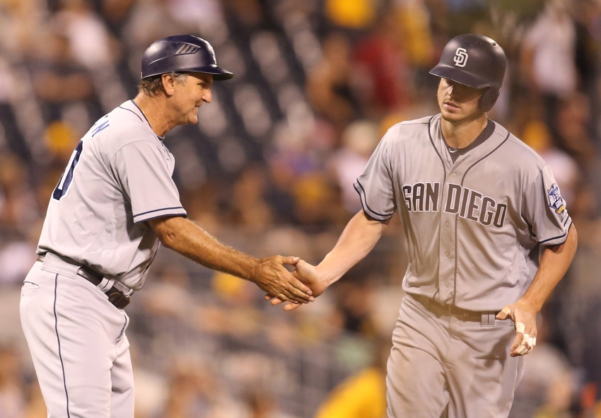 Aug 9, 2016; Pittsburgh, PA, USA; San Diego Padres third base coach Glenn Hoffman (30) greets first baseman Wil Myers (R) after Myers hit a solo home run against the Pittsburgh Pirates during the eighth inning at PNC Park. The Pirates won 6-4.Mandatory Credit: Charles LeClaire-USA TODAY Sports