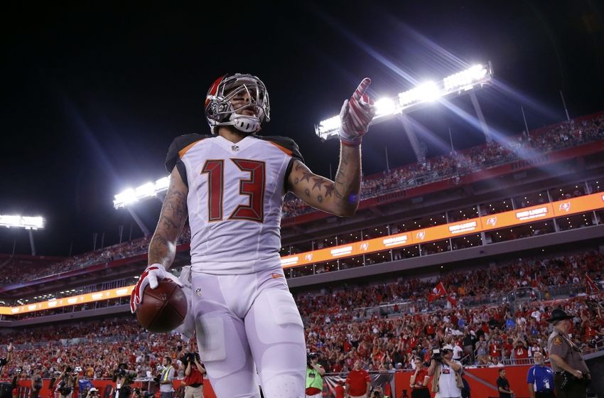 Aug 26, 2016; Tampa, FL, USA; Tampa Bay Buccaneers wide receiver Mike Evans (13) celebrates after he scored a touchdown against the Cleveland Browns during the first half at Raymond James Stadium. Mandatory Credit: Kim Klement-USA TODAY Sports