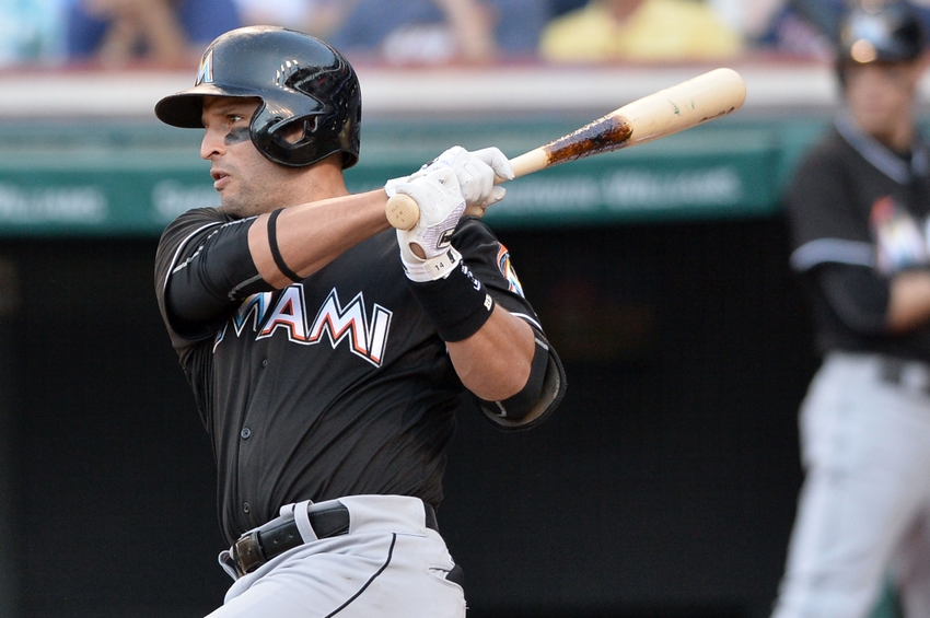 Sep 4, 2016; Cleveland, OH, USA; Miami Marlins designated hitter Martin Prado (14) hits an RBI single during the seventh inning against the Cleveland Indians at Progressive Field. Mandatory Credit: Ken Blaze-USA TODAY Sports