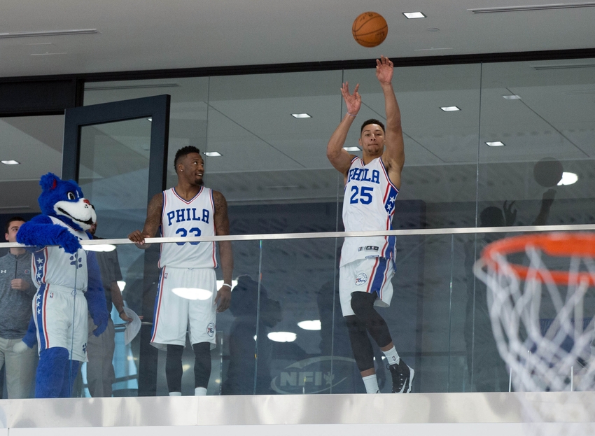 Sep 26, 2016; Philadelphia, PA, USA; Philadelphia 76ers forward Ben Simmons (25) and forward Robert Covington (33) shoot at the basket from the second floor balcony during media day at the Philadelphia 76ers Training Complex. Mandatory Credit: Bill Streicher-USA TODAY Sports