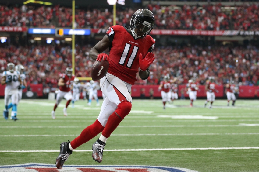 Oct 2, 2016; Atlanta, GA, USA; Atlanta Falcons wide receiver Julio Jones (11) scores a touchdown in the fourth quarter of their game against the Carolina Panthers at the Georgia Dome. The Falcons won 48-33. Mandatory Credit: Jason Getz-USA TODAY Sports