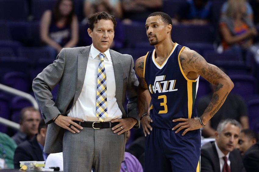 Oct 5, 2016; Phoenix, AZ, USA; Utah Jazz head coach Quin Snyder talks with guard George Hill (3) in the first half of the game against Phoenix Suns at Talking Stick Resort Arena. The Utah Jazz defeated the Phoenix Suns 104-99. Mandatory Credit: Jennifer Stewart-USA TODAY Sports
