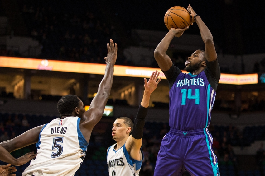 Oct 21, 2016; Minneapolis, MN, USA; Charlotte Hornets forward Michael Kidd-Gilchrist (14) shoots over Minnesota Timberwolves center Gorgui Dieng (5) during the first quarter at Target Center. Mandatory Credit: Brace Hemmelgarn-USA TODAY Sports