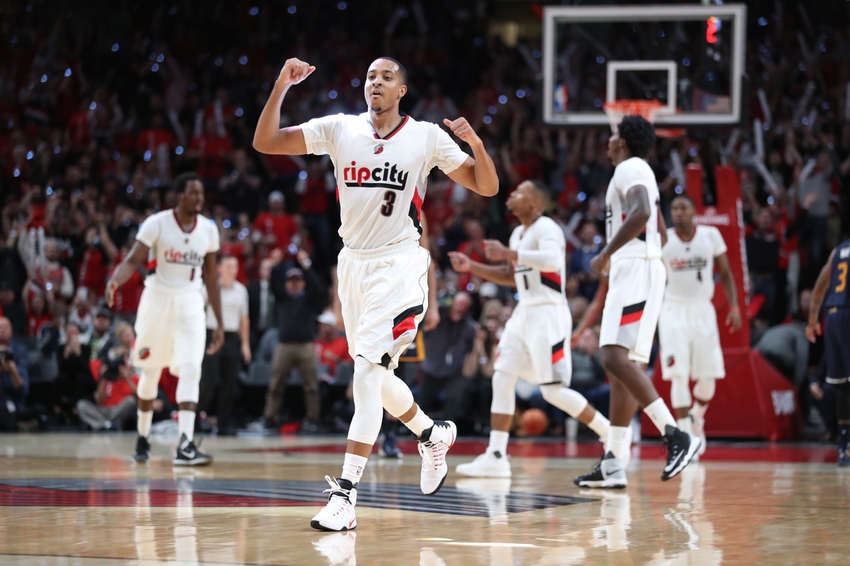 Oct 25, 2016; Portland, OR, USA; Portland Trail Blazers guard C.J. McCollum (3) celebrates after a basket by Trail Blazers guard Damian Lillard (0) late in the fourth quarter against the Utah Jazz at Moda Center at the Rose Quarter. Portland won 113-104. Mandatory Credit: Jaime Valdez-USA TODAY Sports