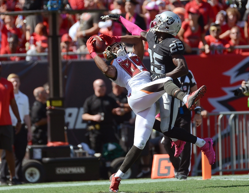 Oct 30, 2016; Tampa, FL, USA; Tampa Bay Buccaneers wide receiver Russell Shepard (89) catches a touchdown pass over Oakland Raiders defensive back D.J. Hayden (25) in the first half at Raymond James Stadium. Mandatory Credit: Jonathan Dyer-USA TODAY Sports