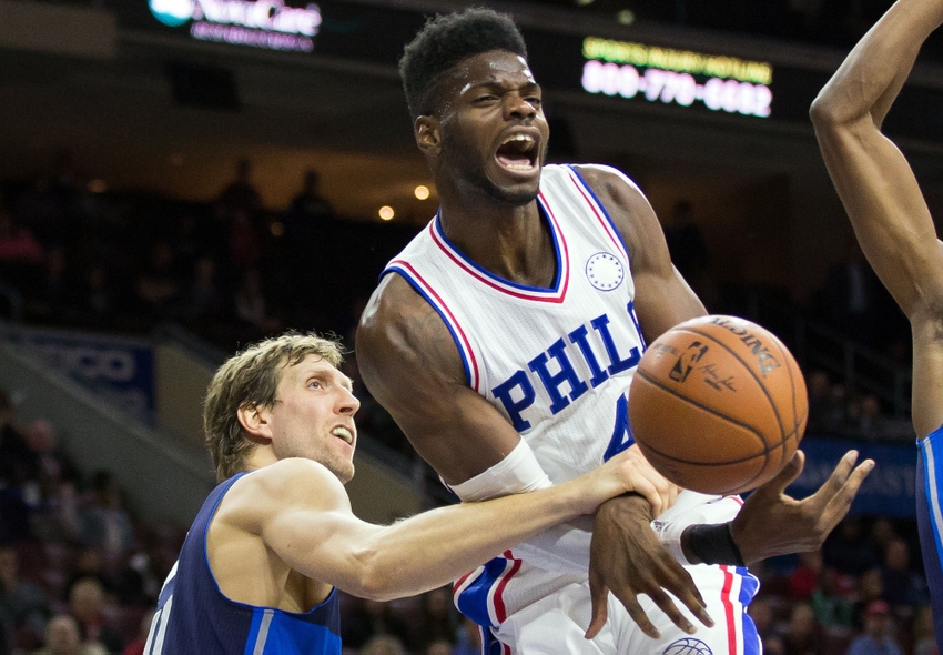 Nov 16, 2015; Philadelphia, PA, USA; Philadelphia 76ers forward Nerlens Noel (4) reacts as he is fouled by Dallas Mavericks forward Dirk Nowitzki (41) during the second half at Wells Fargo Center. The Mavericks won 92-86. Mandatory Credit: Bill Streicher-USA TODAY Sports