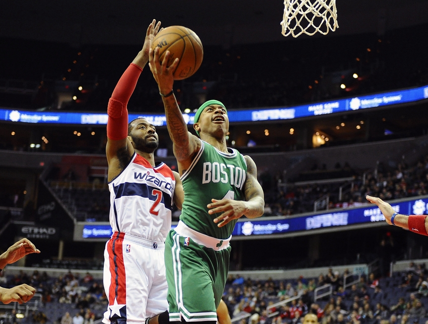 Jan 25, 2016; Washington, DC, USA; Boston Celtics guard Isaiah Thomas (4) shoots as Washington Wizards guard John Wall (2) looks on during the second half at Verizon Center. Boston Celtics won 116 - 91. Mandatory Credit: Brad Mills-USA TODAY Sports