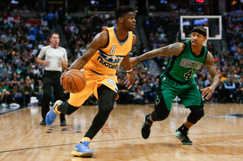 Feb 21, 2016; Denver, CO, USA; Denver Nuggets guard Emmanuel Mudiay (0) dribbles the ball against Boston Celtics guard Isaiah Thomas (4) in the third quarter at the Pepsi Center. The Celtics defeated the Nuggets 121-101. Mandatory Credit: Isaiah J. Downing-USA TODAY Sports