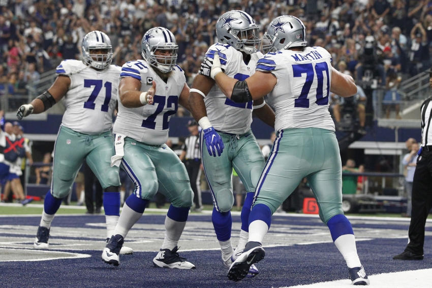 Sep 11, 2016; Arlington, TX, USA; Dallas Cowboys guard Zack Martin (70) and center Travis Frederick (72) celebrate with running back Ezekiel Elliott (21) after he scored a touchdown in the third quarter at AT&T Stadium. Mandatory Credit: Tim Heitman-USA TODAY Sports