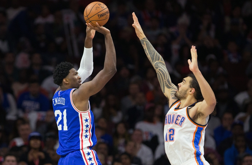 Oct 26, 2016; Philadelphia, PA, USA; Philadelphia 76ers center Joel Embiid (21) shoots against Oklahoma City Thunder center Steven Adams (12) during the first half at Wells Fargo Center. Mandatory Credit: Bill Streicher-USA TODAY Sports