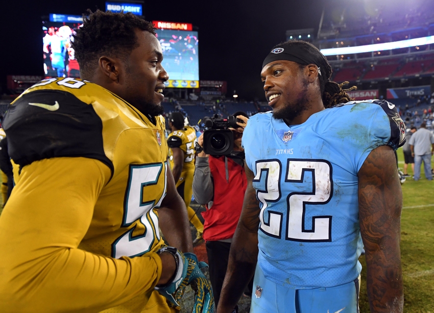 Oct 27, 2016; Nashville, TN, USA; Jacksonville Jaguars defensive end Dante Fowler Jr. (56) talks with Tennessee Titans running back Derrick Henry (22) after the game at Nissan Stadium. The Titans won 36-22. Mandatory Credit: Christopher Hanewinckel-USA TODAY Sports