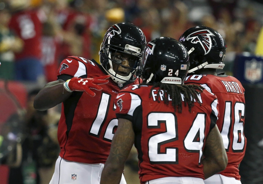 Oct 30, 2016; Atlanta, GA, USA; Atlanta Falcons wide receiver Mohamed Sanu (12) celebrates his touchdown catch with running back Devonta Freeman (24) in the fourth quarter of their game against the Green Bay Packers at the Georgia Dome. The Falcons won 33-32. Mandatory Credit: Jason Getz-USA TODAY Sports