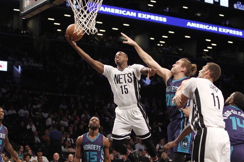 Nov 4, 2016; Brooklyn, NY, USA; Brooklyn Nets guard Isaiah Whitehead (15) puts up a shot against Charlotte Hornets forward Spencer Hawes (00) in the first quarter at Barclays Center. Mandatory Credit: Nicole Sweet-USA TODAY Sports