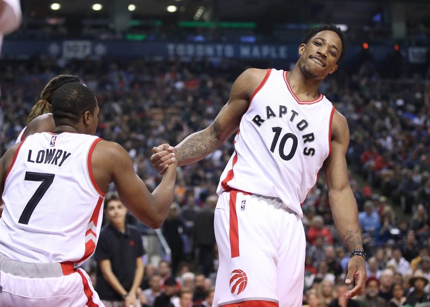 Nov 6, 2016; Toronto, Ontario, CAN; Toronto Raptors guard DeMar DeRozan (10) helps up point guard Kyle Lowry (7) against the Sacramento Kings at Air Canada Centre. The Kings beat the Raptors 96-91. Mandatory Credit: Tom Szczerbowski-USA TODAY Sports