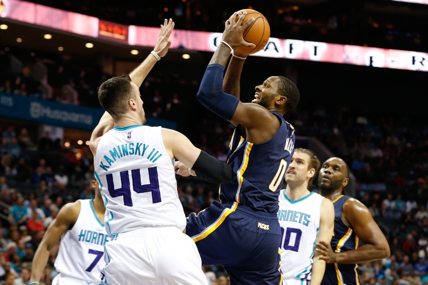 Nov 7, 2016; Charlotte, NC, USA; Indiana Pacers forward C.J. Miles (0) goes up for a shot against Charlotte Hornets center Frank Kaminsky (44) in the first half at Spectrum Center. Mandatory Credit: Jeremy Brevard-USA TODAY Sports