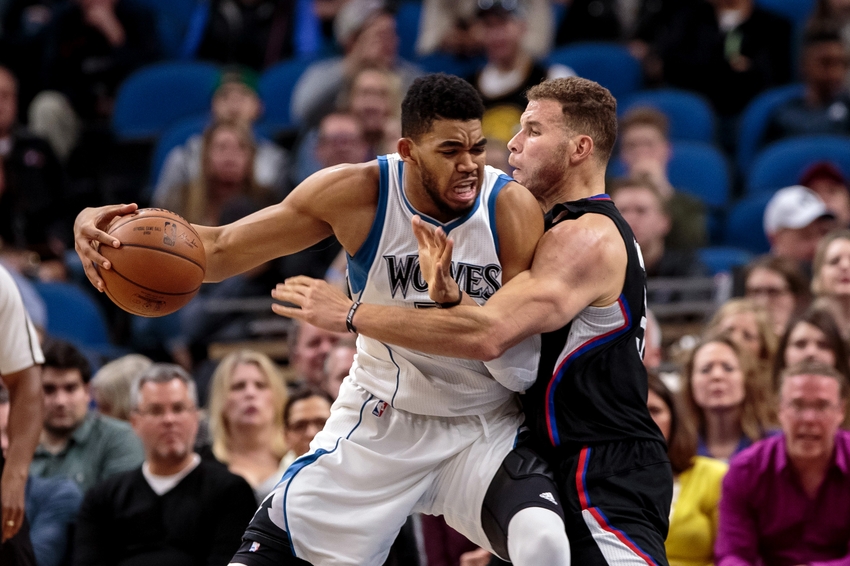 Nov 12, 2016; Minneapolis, MN, USA; Minnesota Timberwolves center Karl-Anthony Towns (32) dribbles in the second quarter against the Los Angeles Clippers forward Blake Griffin (32) at Target Center. Mandatory Credit: Brad Rempel-USA TODAY Sports