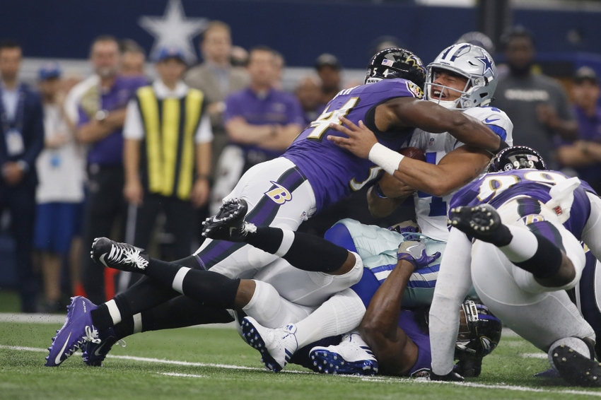 Nov 20, 2016; Arlington, TX, USA; Dallas Cowboys quarterback Dak Prescott (4) is tackled by Baltimore Ravens inside linebacker Zach Orr (54) in the first quarter at AT&T Stadium. Mandatory Credit: Tim Heitman-USA TODAY Sports