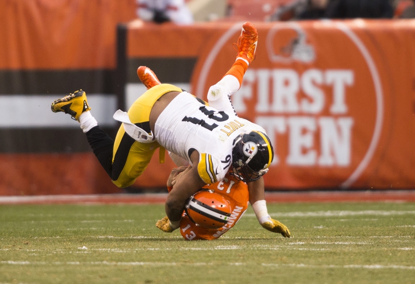 Nov 20, 2016; Cleveland, OH, USA; Cleveland Browns quarterback Josh McCown (13) is tackled by Pittsburgh Steelers defensive end Stephon Tuitt (91) during the fourth quarter at FirstEnergy Stadium. The Steelers won 24-9. Mandatory Credit: Scott R. Galvin-USA TODAY Sports
