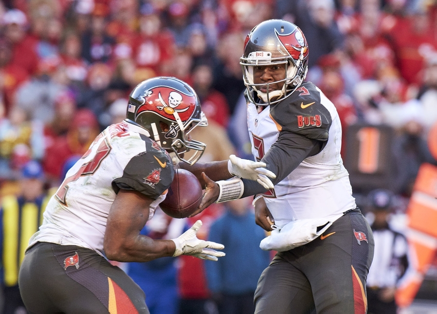 Nov 20, 2016; Kansas City, MO, USA; Tampa Bay Buccaneers quarterback Jameis Winston (3) hands the ball off to running back Doug Martin (22) against the Kansas City Chiefs at Arrowhead Stadium. Mandatory Credit: Gary Rohman-USA TODAY Sports