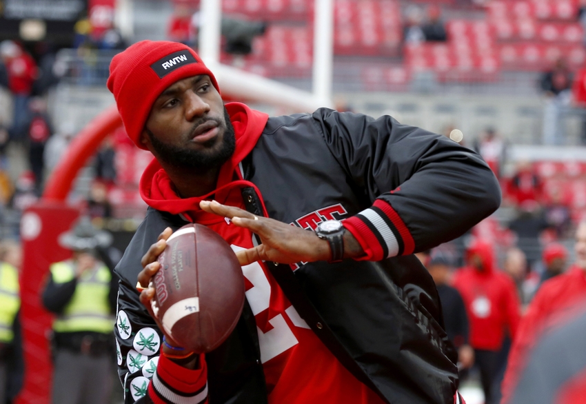 Nov 26, 2016; Columbus, OH, USA; Cleveland Cavaliers player LeBron James plays catch with the Ohio State Buckeyes team before the game against the Michigan Wolverines at Ohio Stadium. Mandatory Credit: Joe Maiorana-USA TODAY Sports