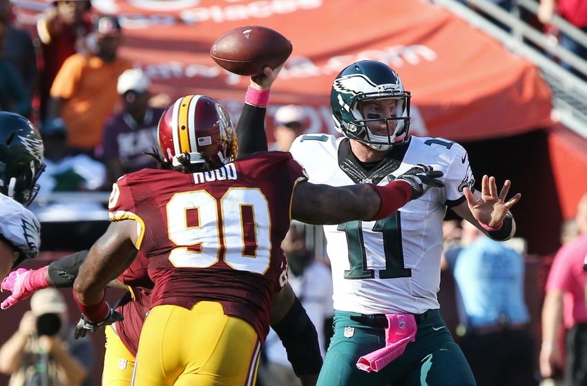 Oct 16, 2016; Landover, MD, USA; Philadelphia Eagles quarterback Carson Wentz (11) throws the ball as Washington Redskins defensive end Ziggy Hood (90) chases in the fourth quarter at FedEx Field. The Redskins won 27-20. Mandatory Credit: Geoff Burke-USA TODAY Sports
