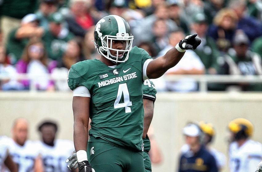 Oct 29, 2016; East Lansing, MI, USA; Michigan State Spartans defensive lineman Malik McDowell (4) points to the sidelines during the first half of a game against the Michigan Wolverines at Spartan Stadium. Mandatory Credit: Mike Carter-USA TODAY Sports