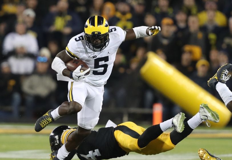 Nov 12, 2016; Iowa City, IA, USA; Michigan Wolverines linebacker Jabrill Peppers (5) carries the ball as Iowa Hawkeyes defensive back Desmond King (14) defends during the first half at Kinnick Stadium. Mandatory Credit: Reese Strickland-USA TODAY Sports